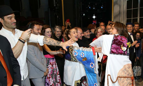 Co-stars and supporters reach out to touch the Gypsy Robe for good luck!