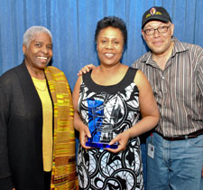 Jackie Taylor, center, accepts her award with Cheryl Lynne Bruce and Luther Goins