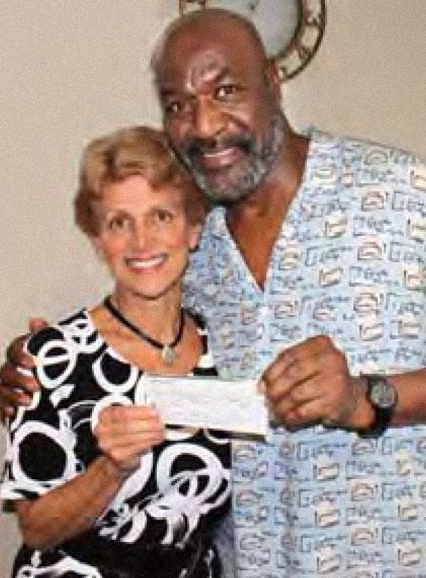 Equity Secretary-Treasurer and VITA Tax Director Sandra Karas with Equity member Delroy Lindo in 2012, when he donated $10,000 to VITA in 